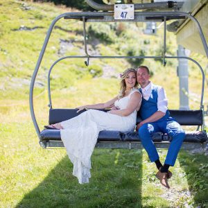 bride and groom on ski lift
